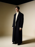 Model wearing the Fjord overcoat in ink over cream knit